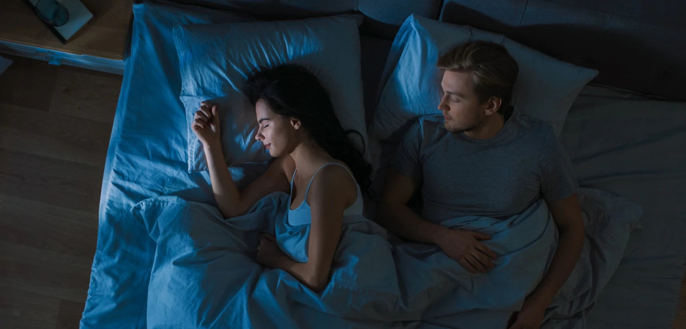 Couple sleeping in bed