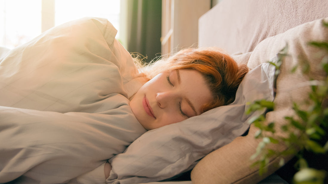 A young sleeping woman in bed
